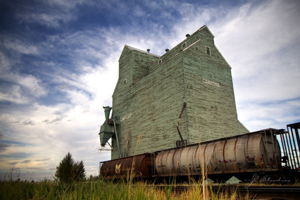 Last Stop in Camrose is an art print of grain elevator in Camrose, Alberta. Heritage photography.
