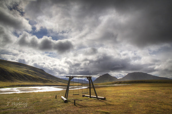 Mountain Playground is an image  the a swing set in the highlands of Iceland.