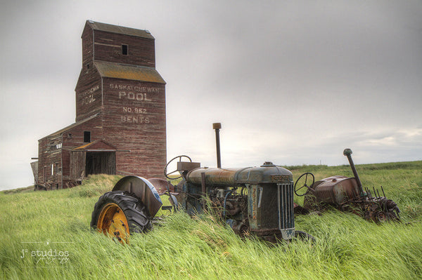 Parked in Bents is an image of an abandoned tractor and grain elevator in this ghost town in Saskatchewan, Heritage photography.
