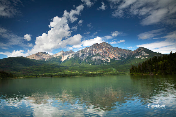 Image of the iconic Pyramid Mountain looming over Pyramid Lake in Jasper National Park, Alberta, Canada.