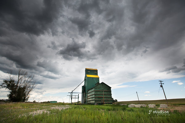 Image of the weathered Grain Elevator in Delia, Alberta moments before the storm.  Dramatic Big Sky photography.