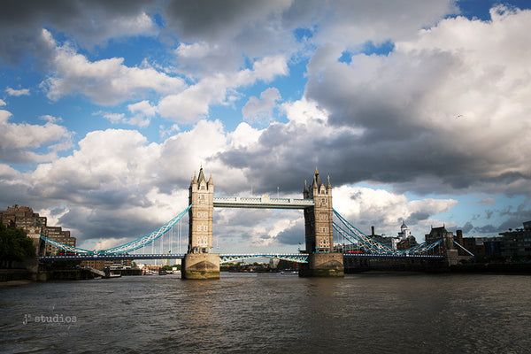 Image of the famous landmark in London, England called Tower Bridge. Dramatic travel themed photography.