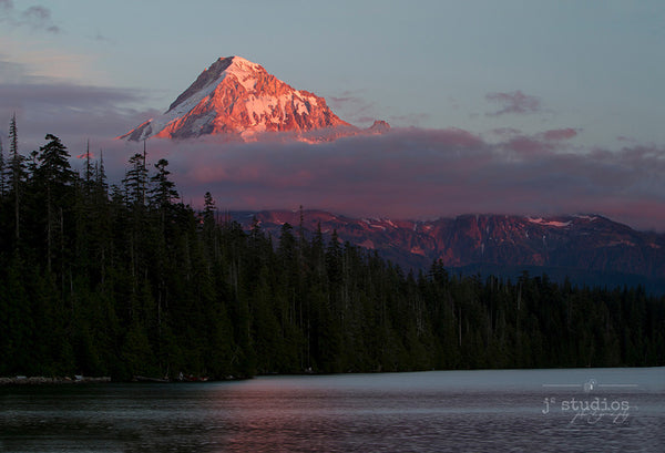 Twilight on the Hood is an image of Mount Hood looming over the evergreen forest of Lost Lake in Oregon.