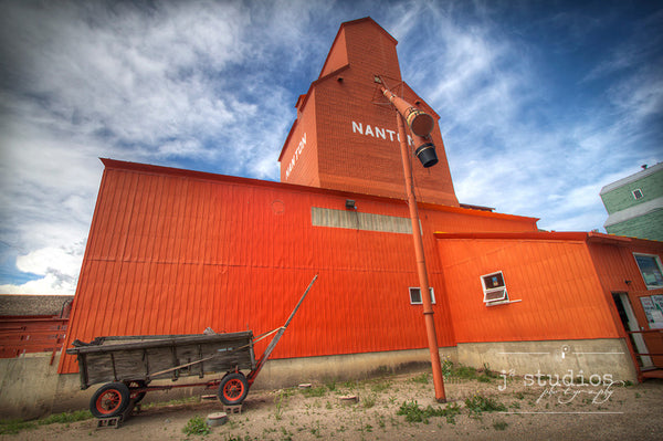 Art print of the beautiful orange grain elevator in Nanton, Alberta. Canadian Prairies photography.