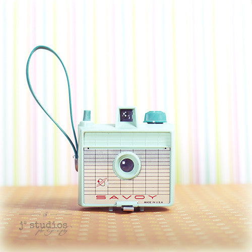 Vintage Camera #7 is an art print of a mint green Imperial Savoy film camera from the 1960s.