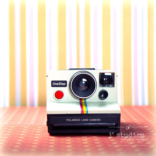 Vintage Camera #3 is an art print of the 1980s Polaroid Instant One Step Film Camera.