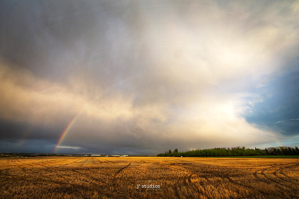 Double Rainbow arcing over a farmers field in Heritage Valley in South Edmonton.